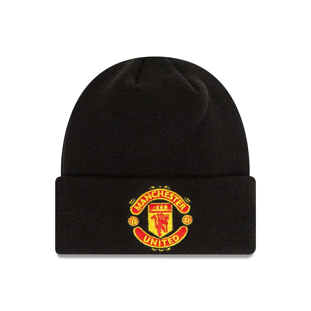 Manchester United FC Youth Black Cuff Knit Beanie Hat, front view showing the raised embroidered Manchester United crest in red and yellow centred on the folded cuff of the black knit fabric.