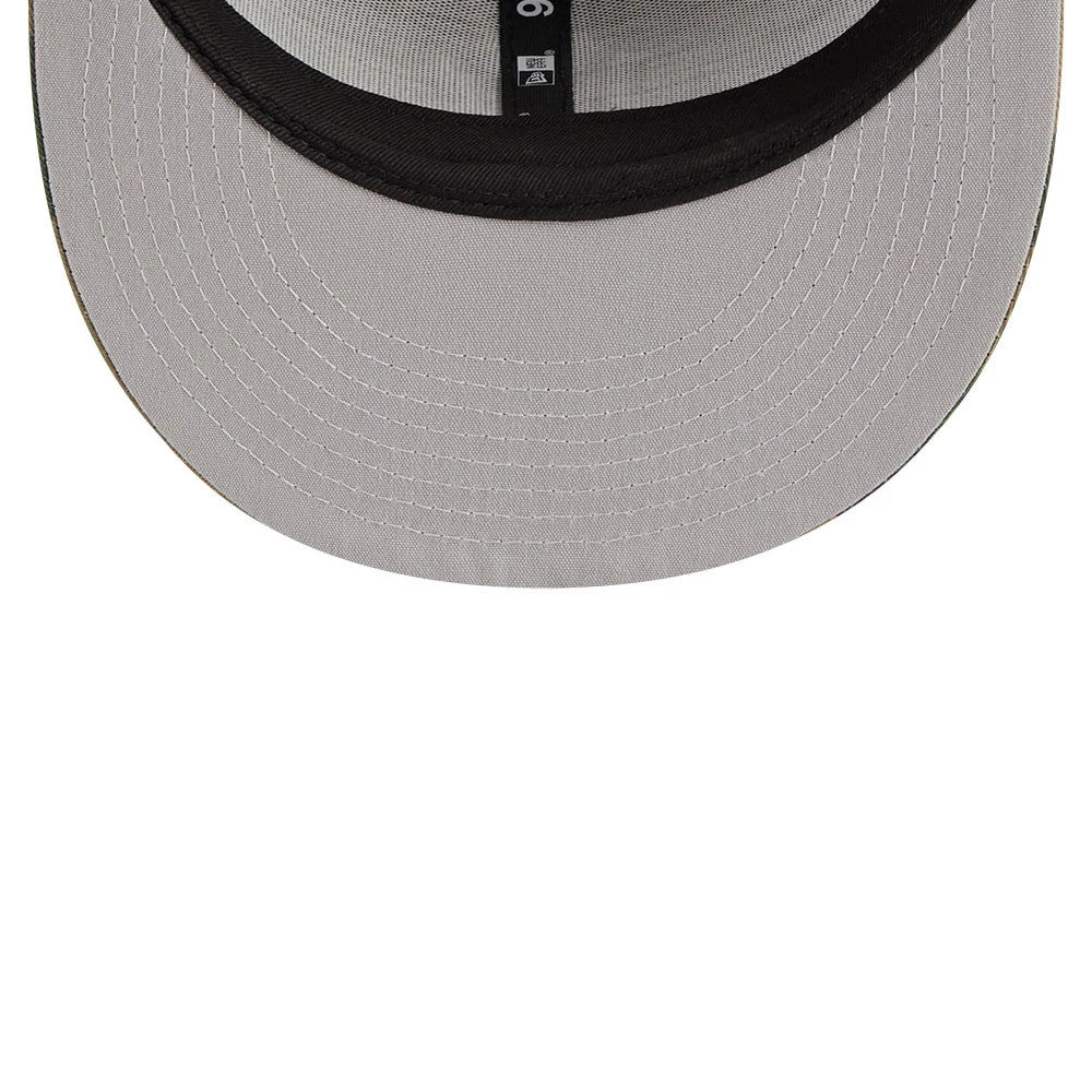 New York Yankees MLB Evergreen Camo New Era 9FIFTY Trucker Adjustable Cap, inside view showing the black taping with white stitching and the grey undervisor, creating a contrast with the structured crown.