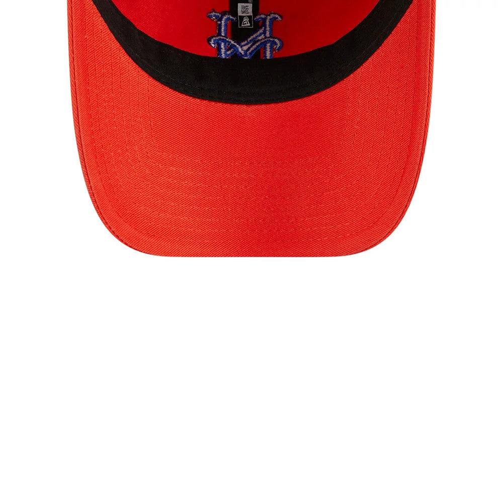 New York Mets MLB Evergreen Orange New Era 9TWENTY Adjustable Cap, inside view showing black taping and the New Era label, with the embroidered Mets logo in blue and white on the inner band and the orange underside of the visor.