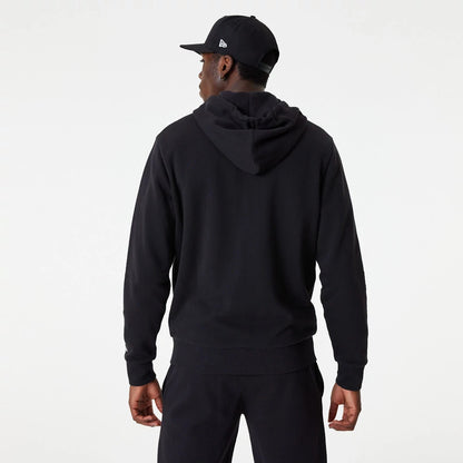 LA Dodgers MLB Essential Black Full Zip Hoodie, on-model rear view showing the black hoodie with a relaxed fit, the hood lying flat against the back, matched with a black cap featuring a raised New Era logo on the side.