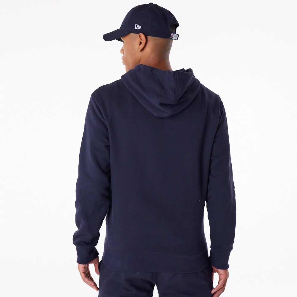 New York Yankees MLB Essential Navy Full Zip Hoodie, rear view showing the plain navy back with a spacious hood, worn by a figure in a navy cap with a debossed New Era logo on the side.