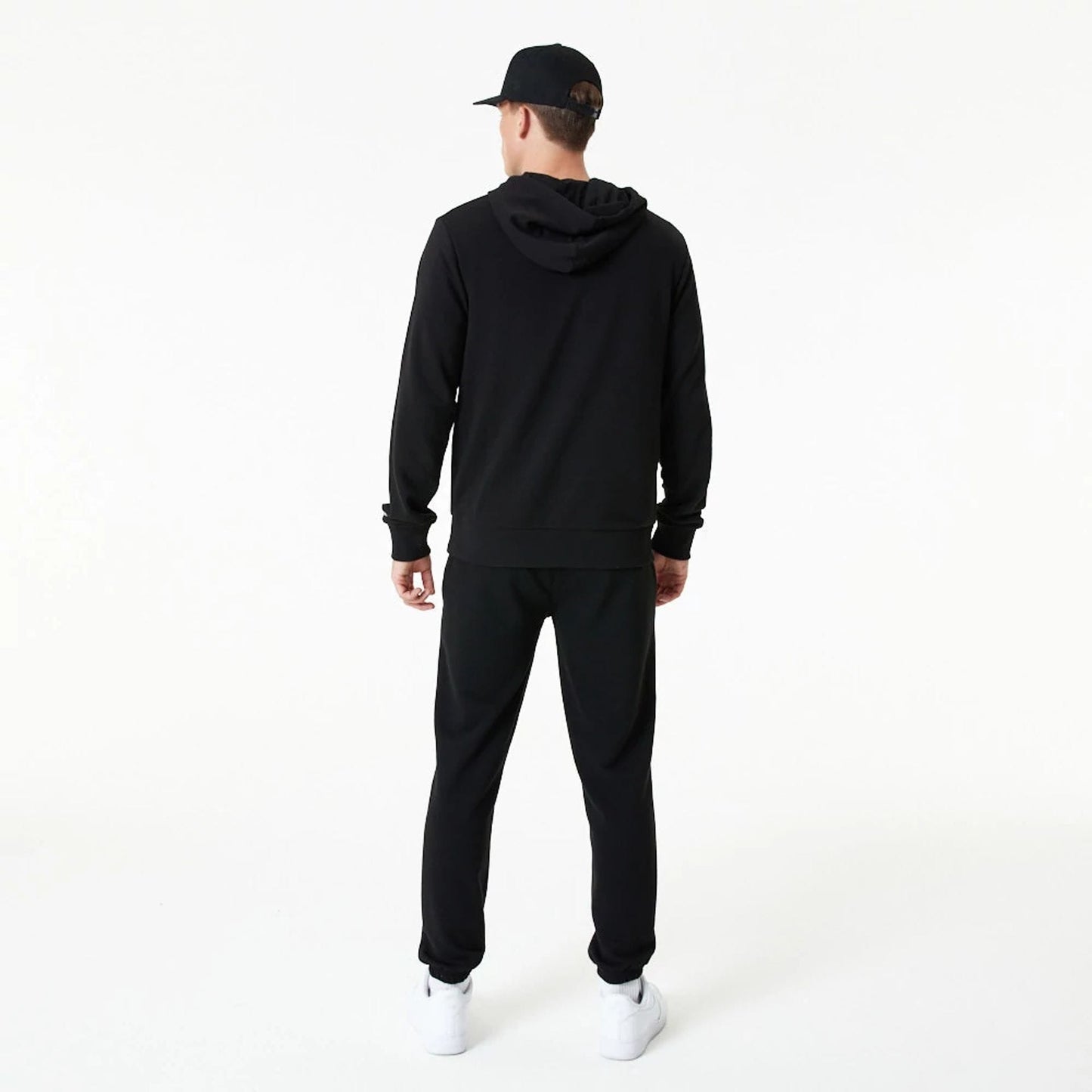 The Male model is wearing New Era Essential Black Pullover Hoodie 7