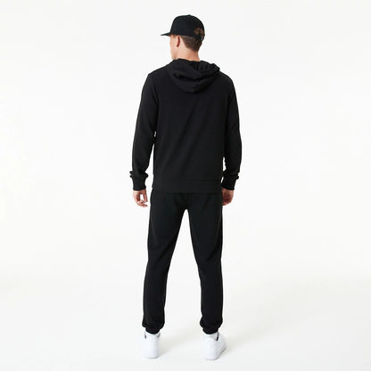 The Male model is wearing New Era Essential Black Pullover Hoodie 7