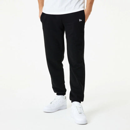 The Male model is wearing New Era Essential Black Joggers 1