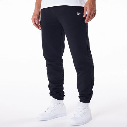 The Male model is wearing New Era Essential Black Joggers 6