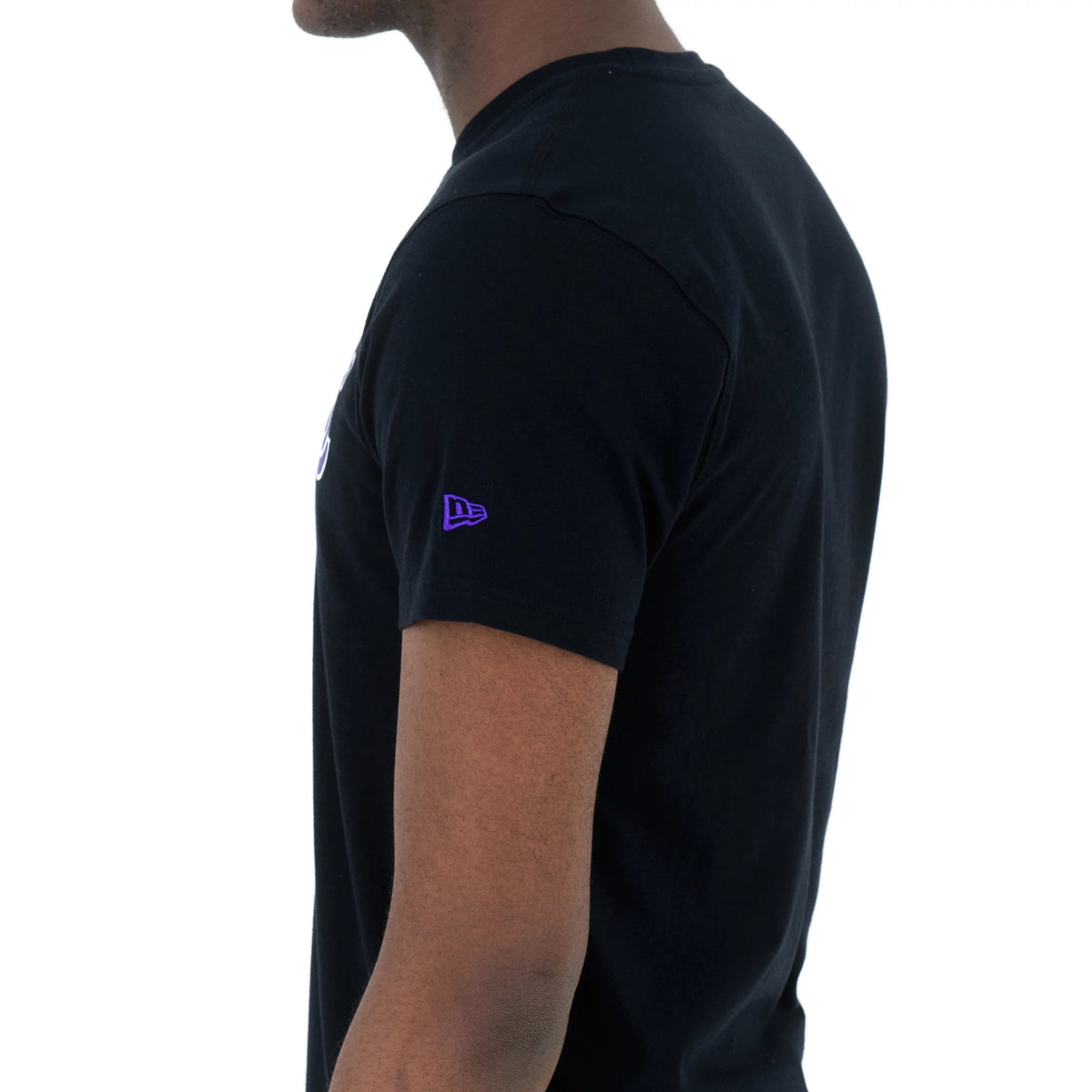 LA Lakers NBA Regular Black T-Shirt, side view showing a plain black short sleeve with a small raised purple New Era logo on the upper arm and the edge of a white printed element on the chest.