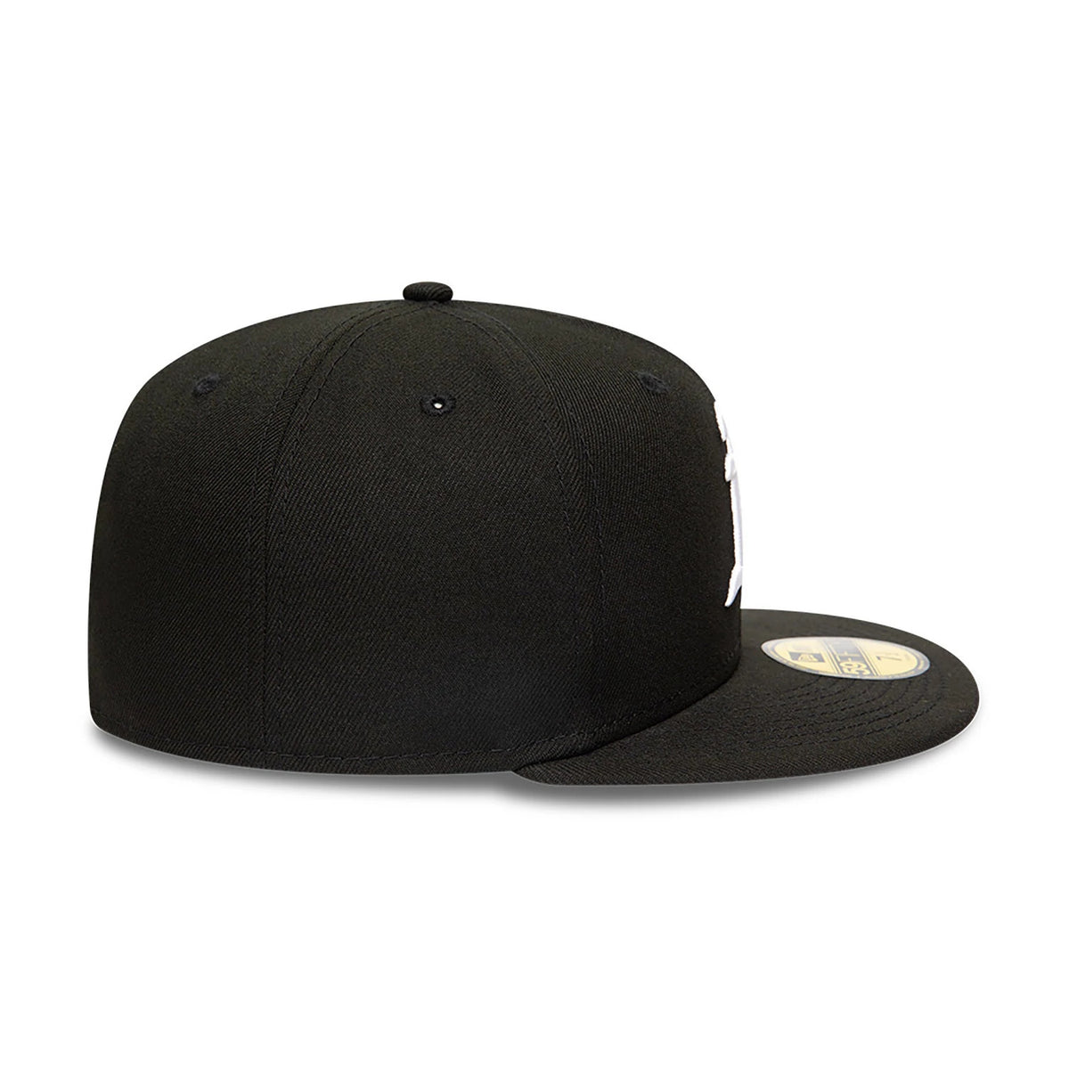 Athletics MLB Black and White New Era 59FIFTY Fitted Cap, side view showing the flat black visor with a gold 59FIFTY size sticker and the embroidered logo on the front panel, with a structured black crown and black eyelets.