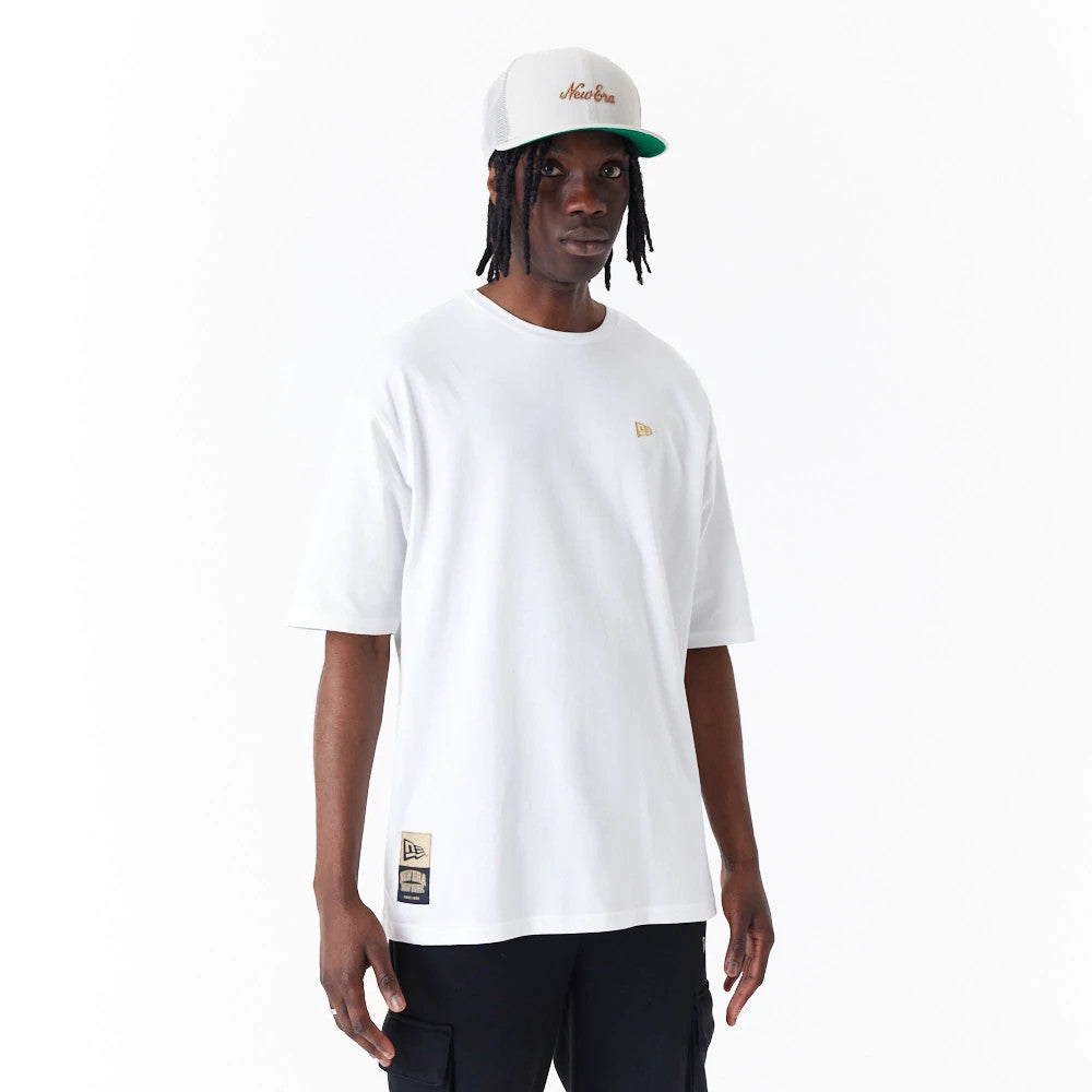 The Male model is wearing New Era Sticker White Oversized T-Shirt 1