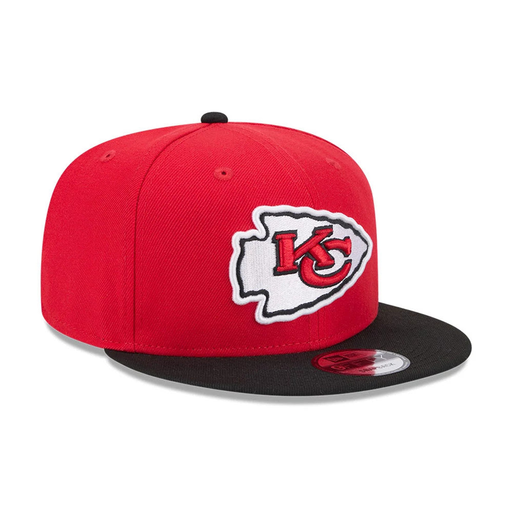 Kansas City Chiefs NFL Evergreen Red New Era 9FIFTY Snapback Adjustable Cap, front view showing the raised KC logo on the front panels, with a contrasting black visor and 9FIFTY size sticker on the top.