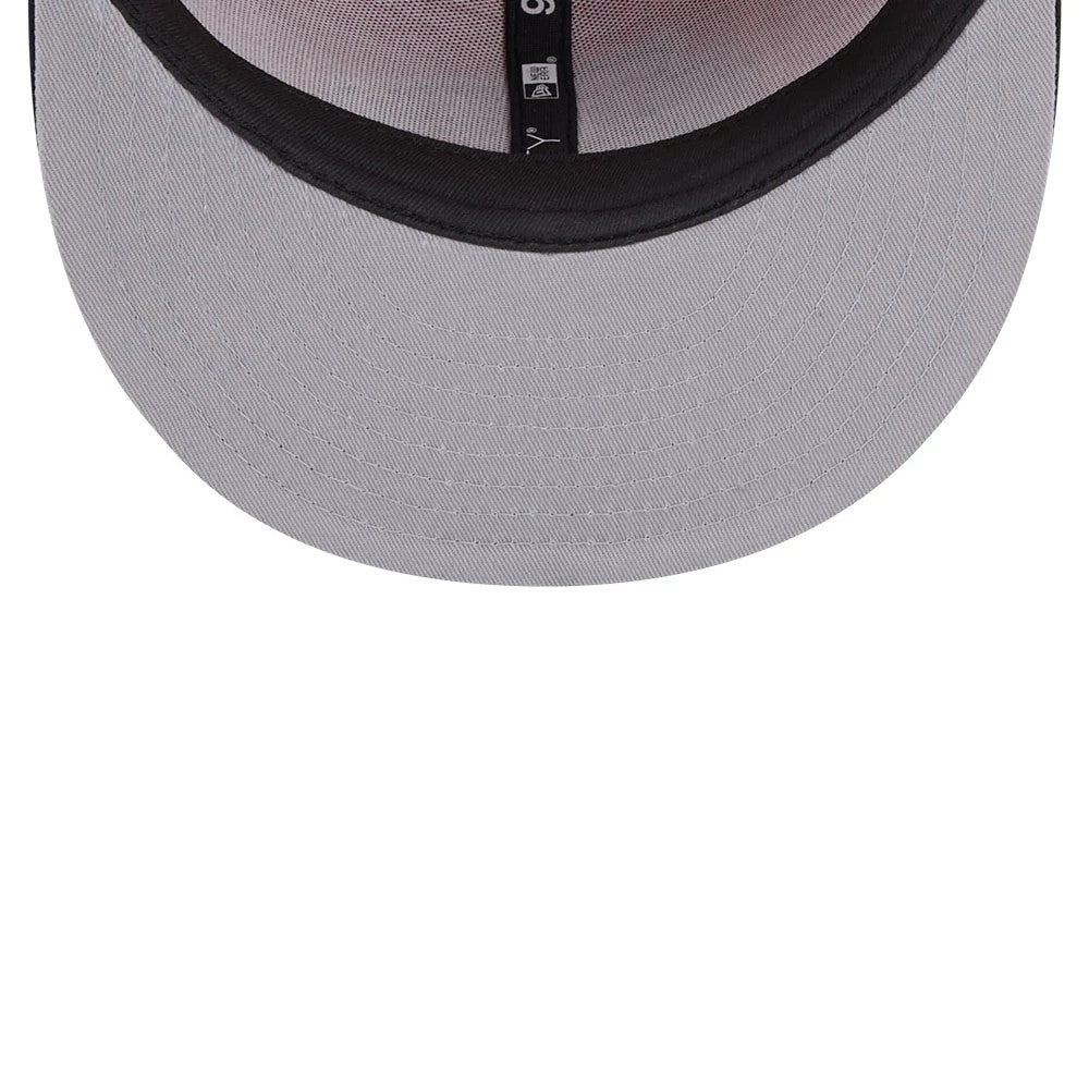 Kansas City Chiefs NFL Evergreen Red New Era 9FIFTY Snapback Adjustable Cap, inside view showing black taping with white lettering along the seams, a grey undervisor and the 9FIFTY size sticker positioned on it.