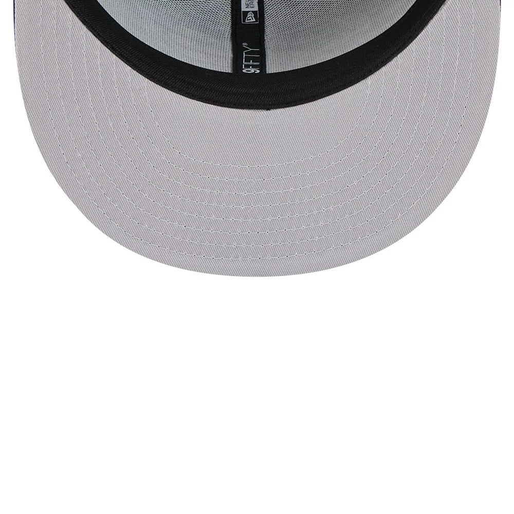 Eagles NFL Evergreen Dark Green New Era 9FIFTY Snapback Adjustable Cap, inside view showing black taping with branding and a light undervisor, highlighting the classic cap construction and design details.