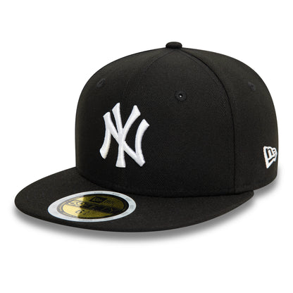 New York Yankees Youth Black New Era 59FIFTY Fitted Cap, three-quarter view showing the raised white NY logo embroidered on the front panel, black visor with gold 59FIFTY size sticker, and New Era flag logo on the left side.