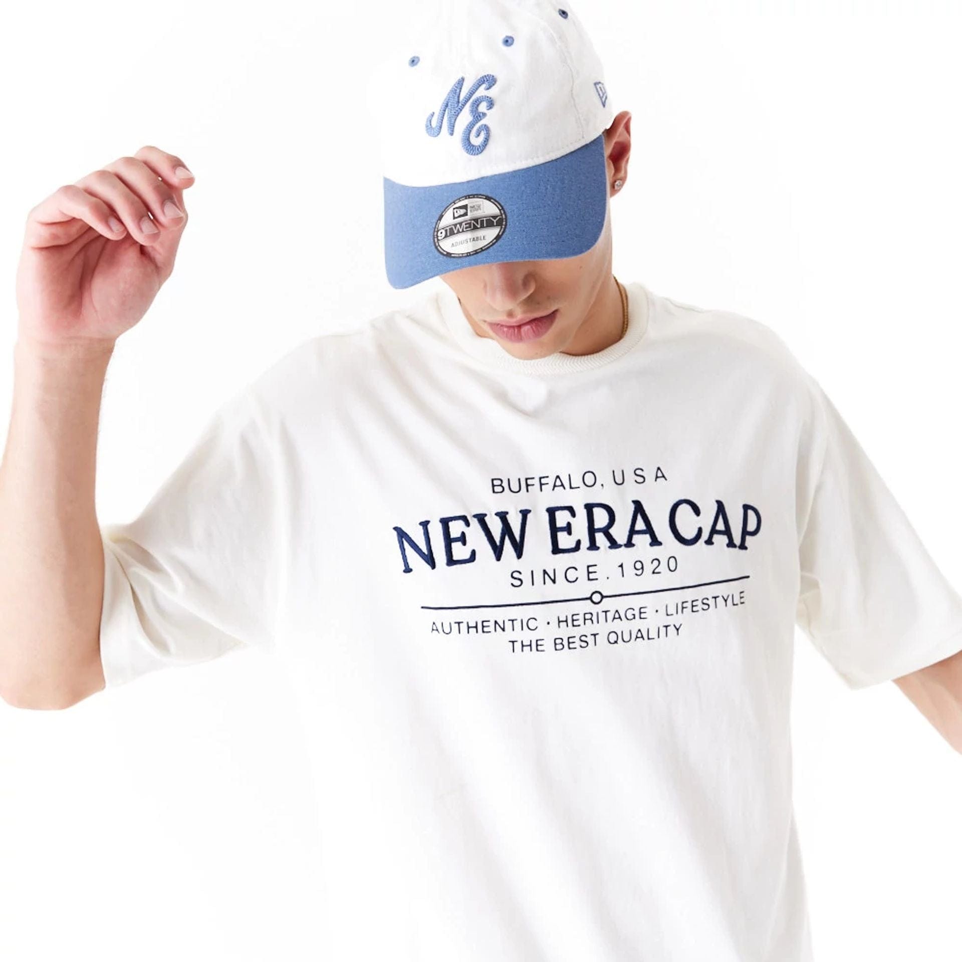 The Male model is wearing New Era Graphic White Oversized T-Shirt 6