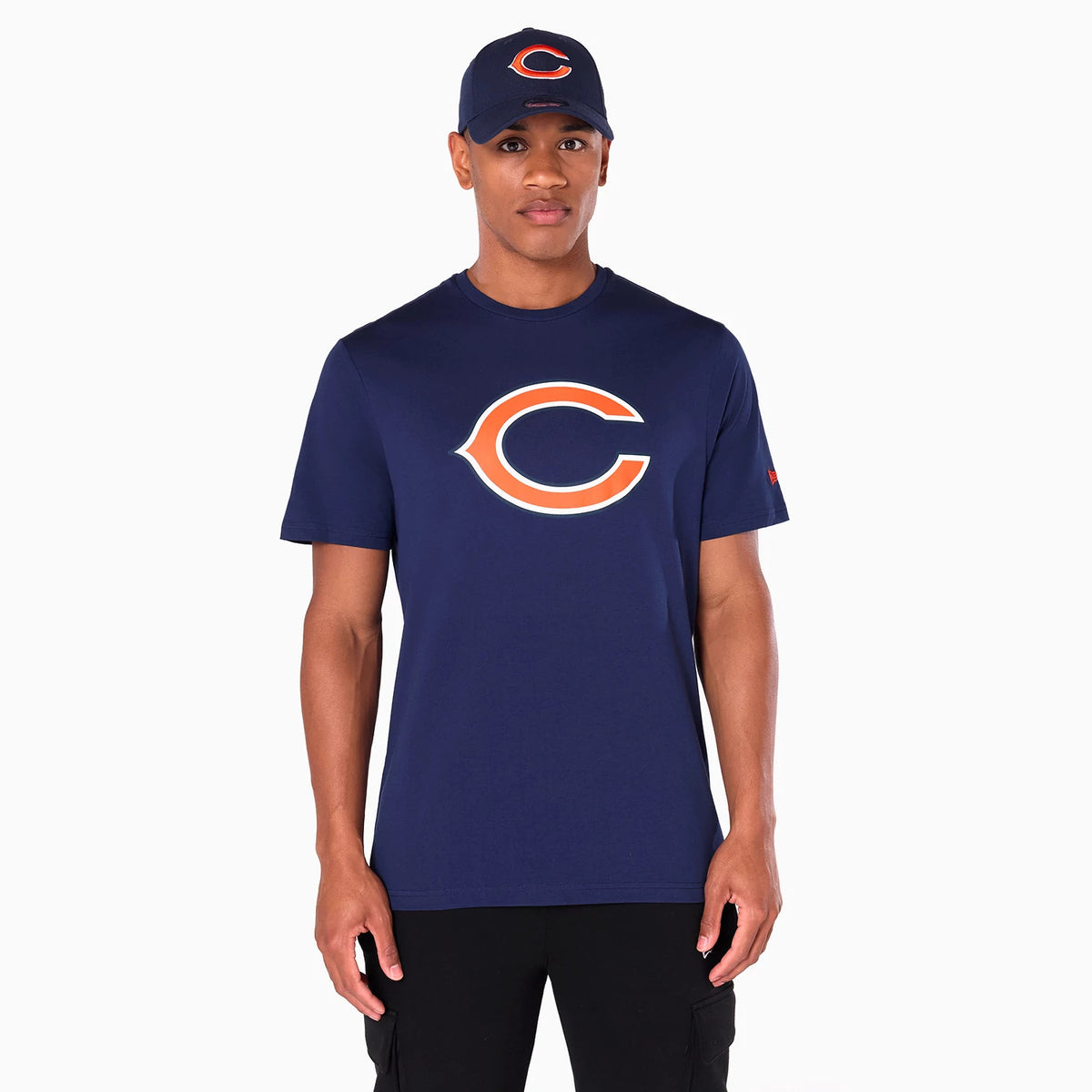 New Era Chicago Bears NFL Navy T-Shirt, front view showing a large orange and white team logo centred on the chest of the navy shirt, worn by a model with a matching navy cap featuring an orange debossed logo.