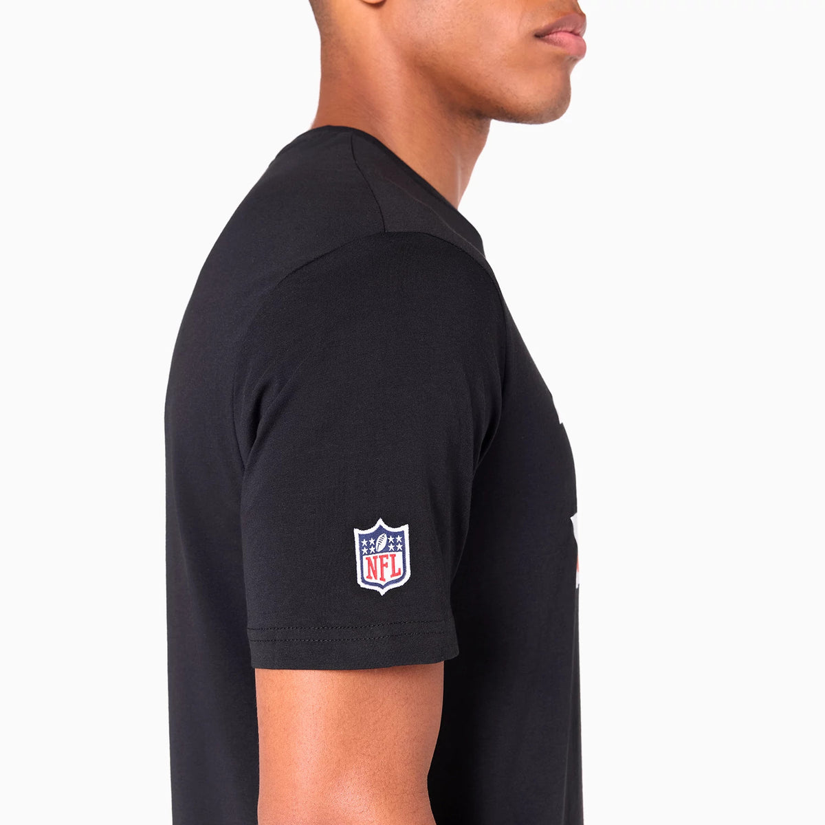 New Era Cincinnati Bengals NFL Black T-Shirt, side view showing the black fabric with an embroidered NFL shield logo on the sleeve, worn by a person, highlighting the shirt's simple design and clean lines.