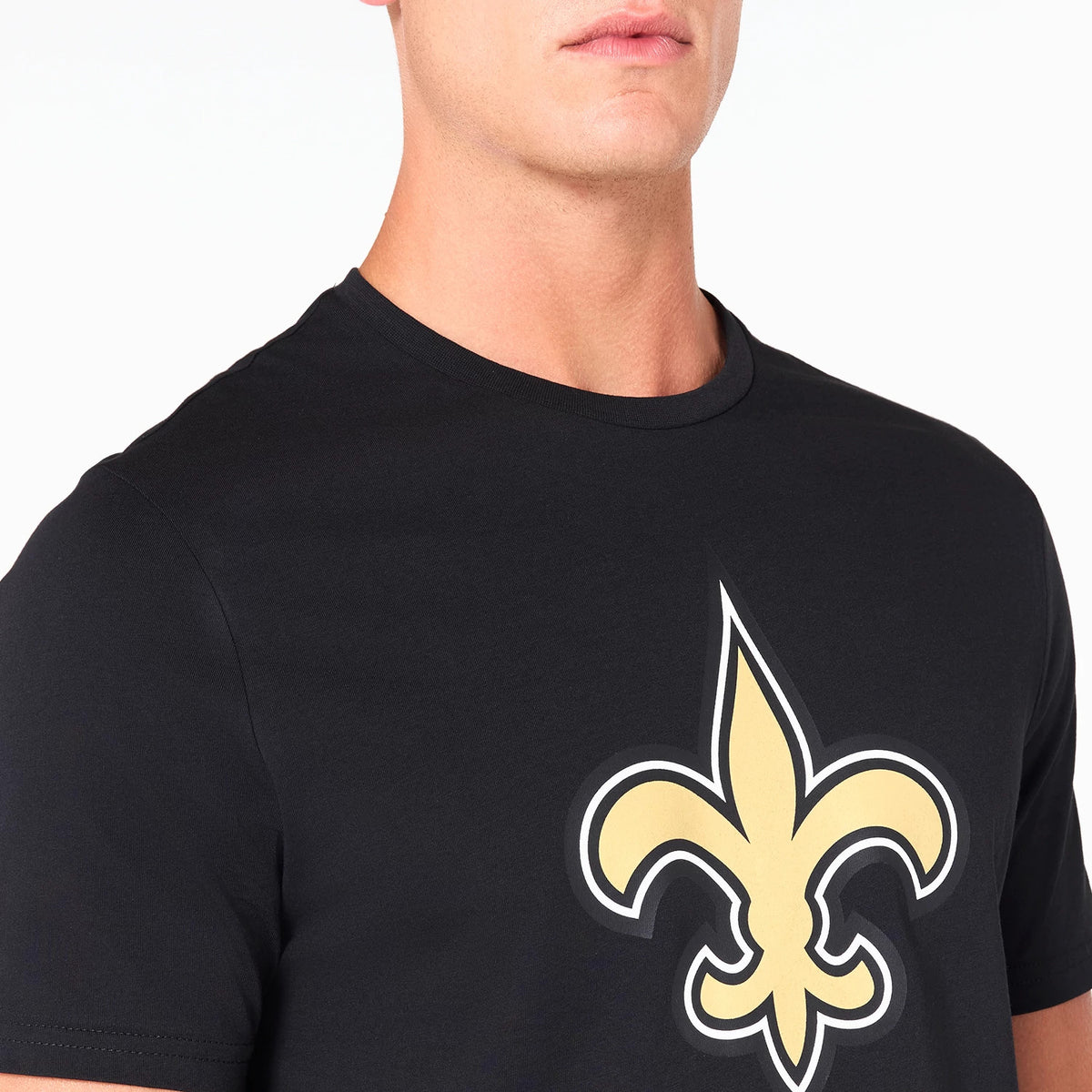 New Era New Orleans Saints NFL Black T-Shirt, front view showing a large gold fleur-de-lis emblem centred on the chest against a black background with a round neckline and short sleeves.