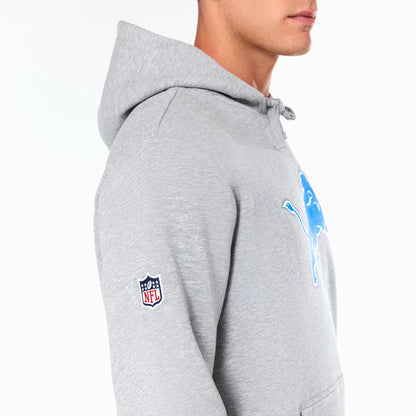 New Era Detroit Lions NFL Grey Pullover Hoodie, side view showing a grey hoodie with the embroidered Detroit Lions logo in blue on the chest and an embroidered NFL logo on the left sleeve.