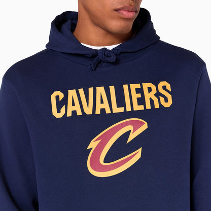 New Era Cleveland Cavaliers NBA Navy Pullover Hoodie, front view featuring the bold yellow CAVALIERS text across the chest above a large red and yellow C logo, complete with a drawstring hood and a glimpse of the wearer's face.
