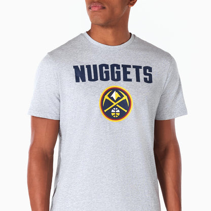 New Era Denver Nuggets NBA Grey T-Shirt, front view showing a large navy NUGGETS text across the chest and the team's logo printed below, featuring a pickaxe and mountain design in yellow and navy on a light grey background.