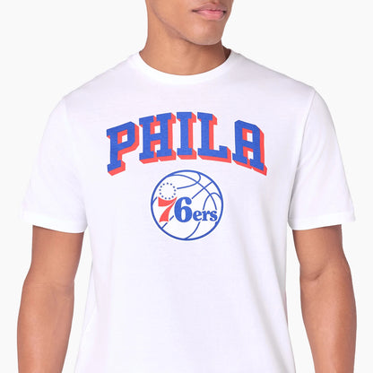 New Era Philadelphia 76ers NBA White T-Shirt, front view showing the word PHILA in bold blue and red letters above a blue basketball graphic with 76ers printed in red and blue on the chest.