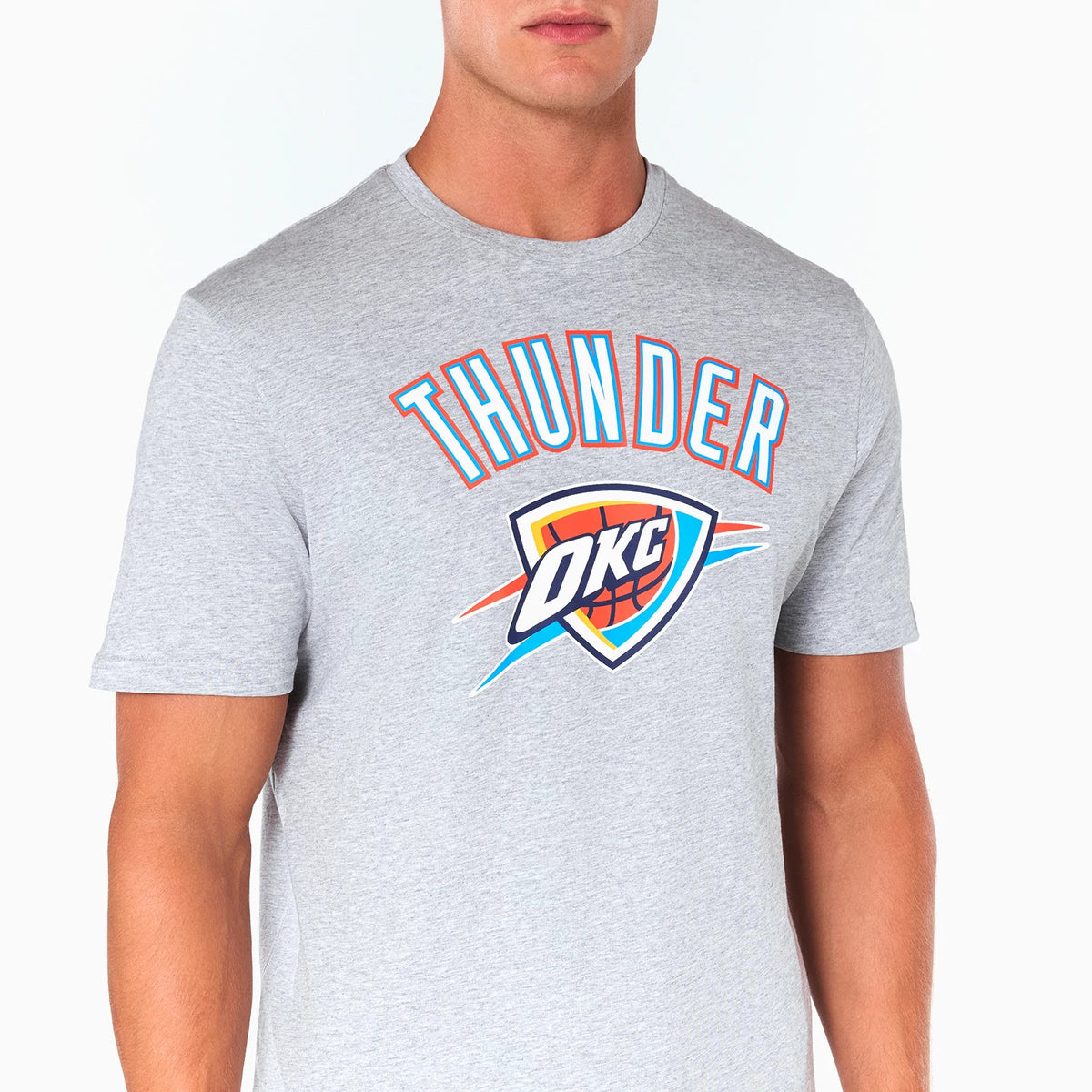 New Era Oklahoma City Thunder NBA Grey T-Shirt, front view showing the word THUNDER in bold blue and orange letters arched above the large OKC team logo on the chest, printed on a light grey base.