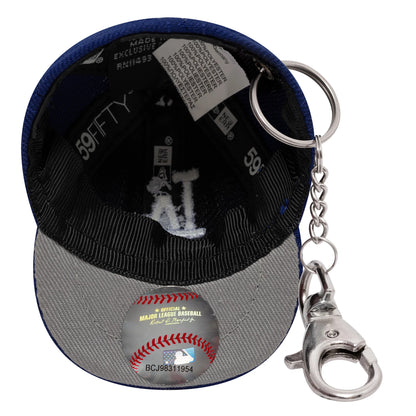 New Era LA Dodgers MLB Mini Cap Dark Blue Key Chain, inside view showing grey undervisor with MLB hologram sticker and black sweatband, featuring a white embroidered LA logo, a 59FIFTY label, and a silver keyring attached.