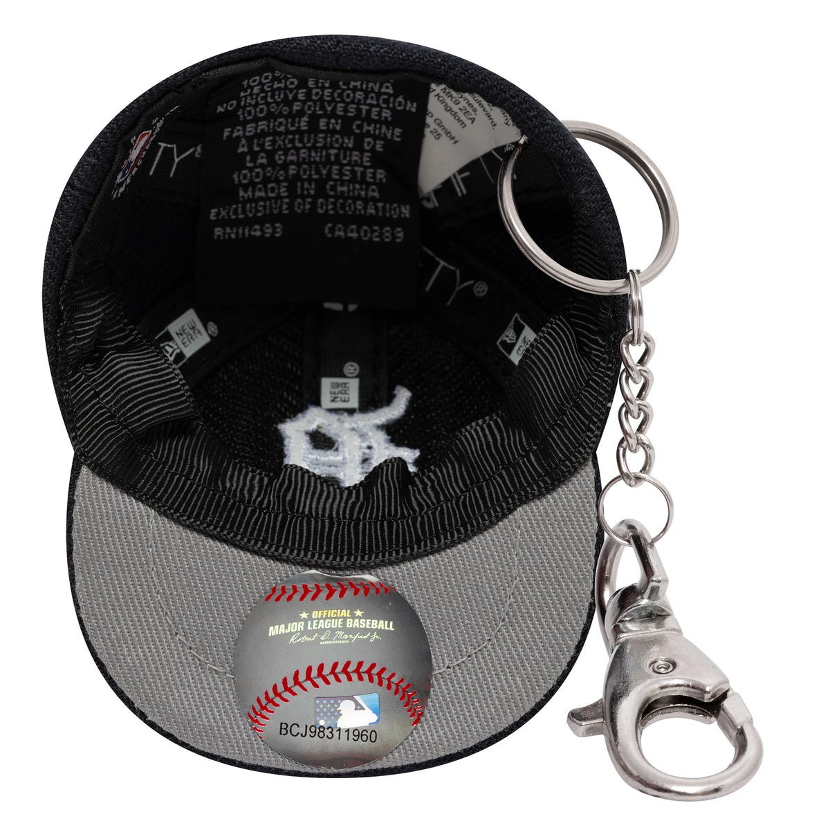 New Era Detroit Tigers MLB Mini Cap Navy Key Chain, inside view showing a white embroidered team logo on the grey undervisor, a fabric tag with branding, and a chain and clasp attached to the back for easy attachment to keys.