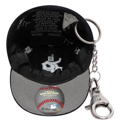New Era Detroit Tigers MLB Mini Cap Navy Key Chain, inside view showing a white embroidered team logo on the grey undervisor, a fabric tag with branding, and a chain and clasp attached to the back for easy attachment to keys.