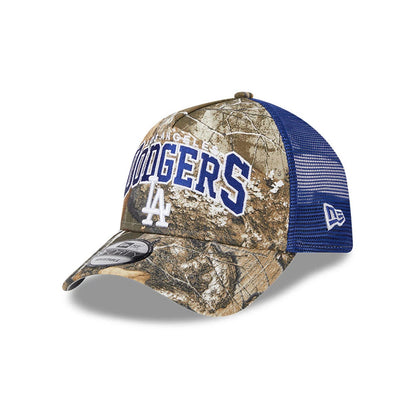 Pictured is this MLB Realtree Camo LA Dodgers 9FORTY A-Frame Trucker Adjustable cap in dark blue. 1