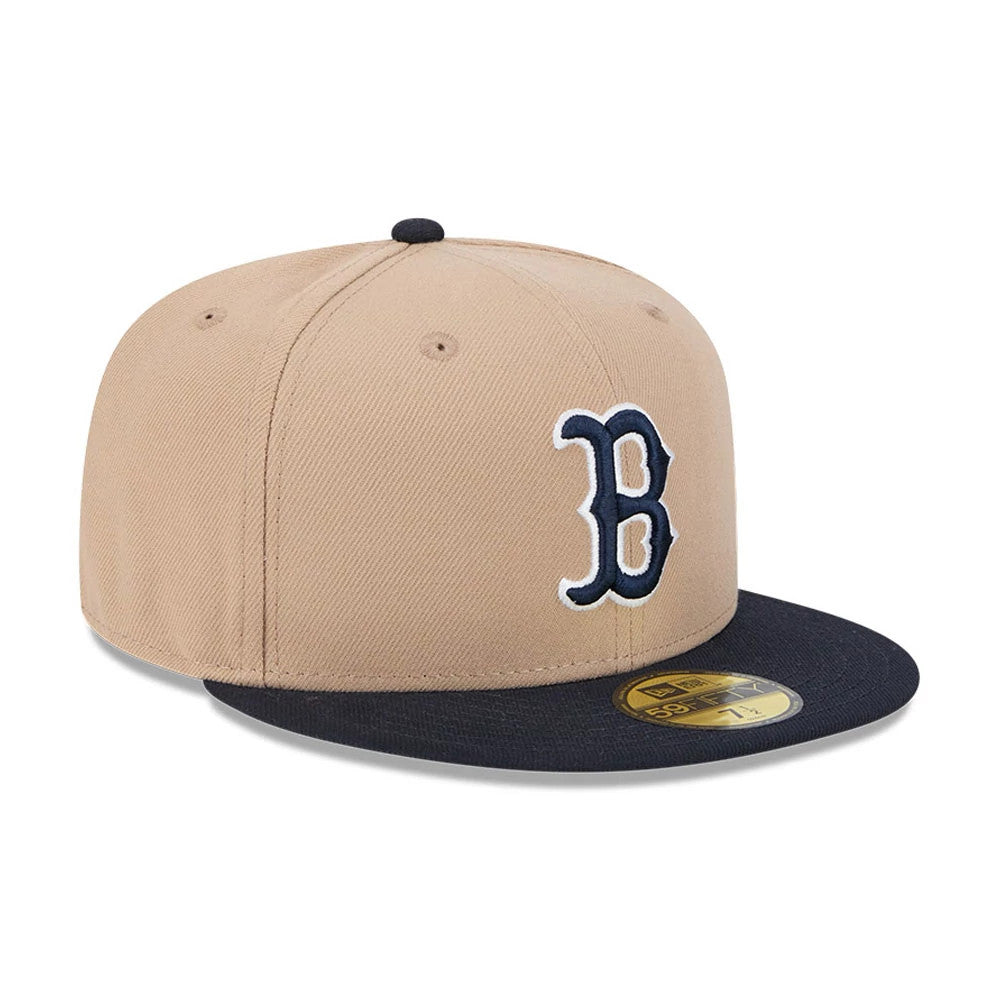 Boston Red Sox MLB Evergreen Light Beige New Era 59FIFTY Fitted Cap, three-quarter view showing the navy raised embroidered B logo on the front panel, a contrasting dark visor, and the gold 59FIFTY size sticker on the top.