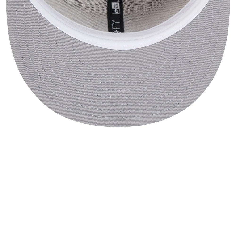 Boston Red Sox MLB Evergreen Light Beige New Era 59FIFTY Fitted Cap, inside view showing the white sweatband and grey undervisor beneath the flat visor, with black taping featuring white New Era branding.