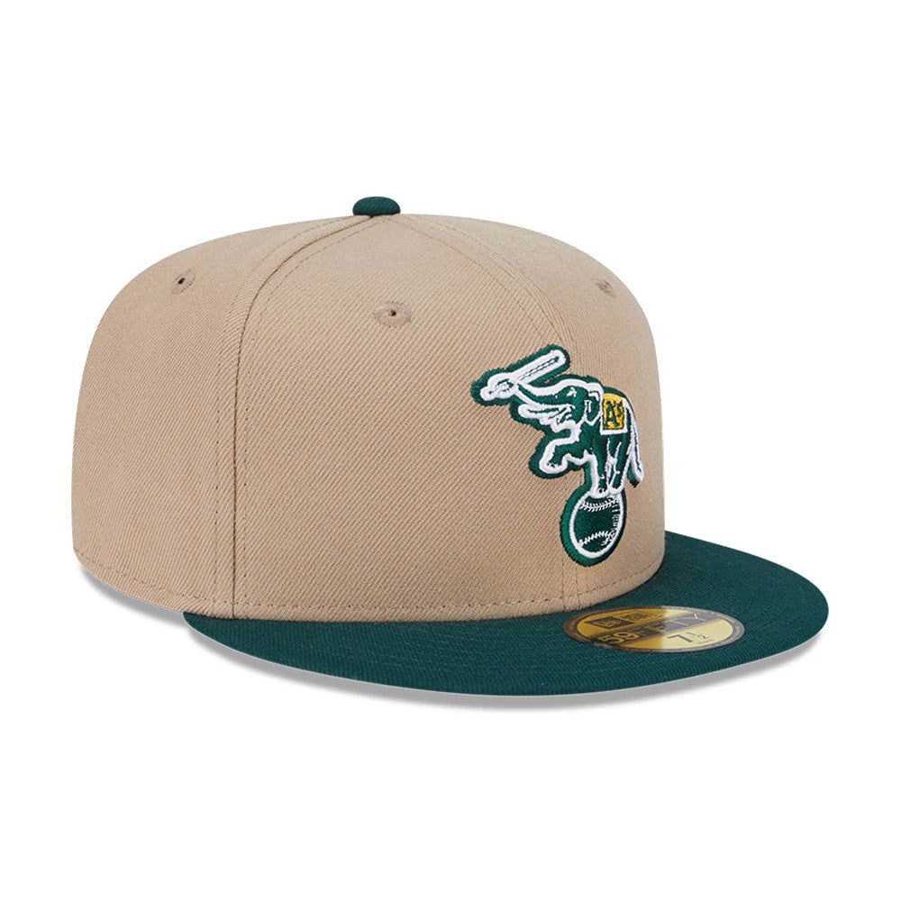 Athletics MLB Evergreen Light Beige New Era 59FIFTY Fitted Cap, front view showing the white and green embroidered elephant logo on the front panel, with a dark green visor and a gold 59FIFTY size sticker.