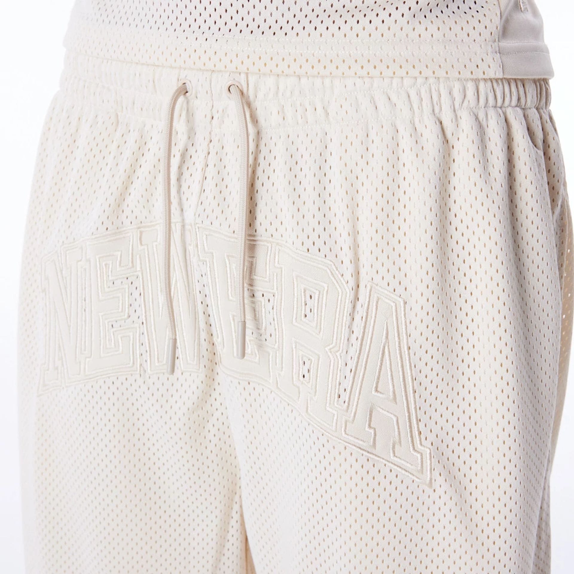 The Male model is wearing New Era Mesh Stone Oversized Shorts 4