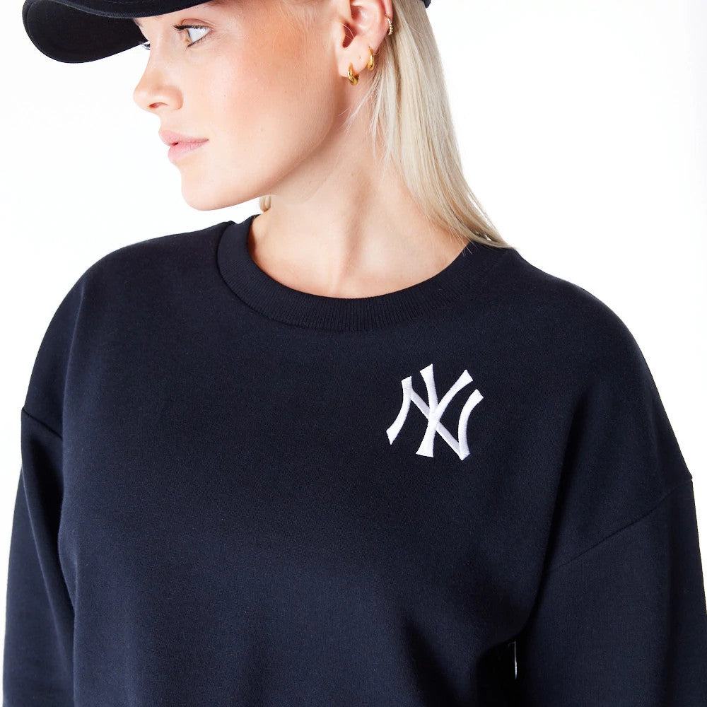 The Female model is wearing New York Yankees Womens MLB League Essential Black Crop Crew Neck Sweatshirt 6