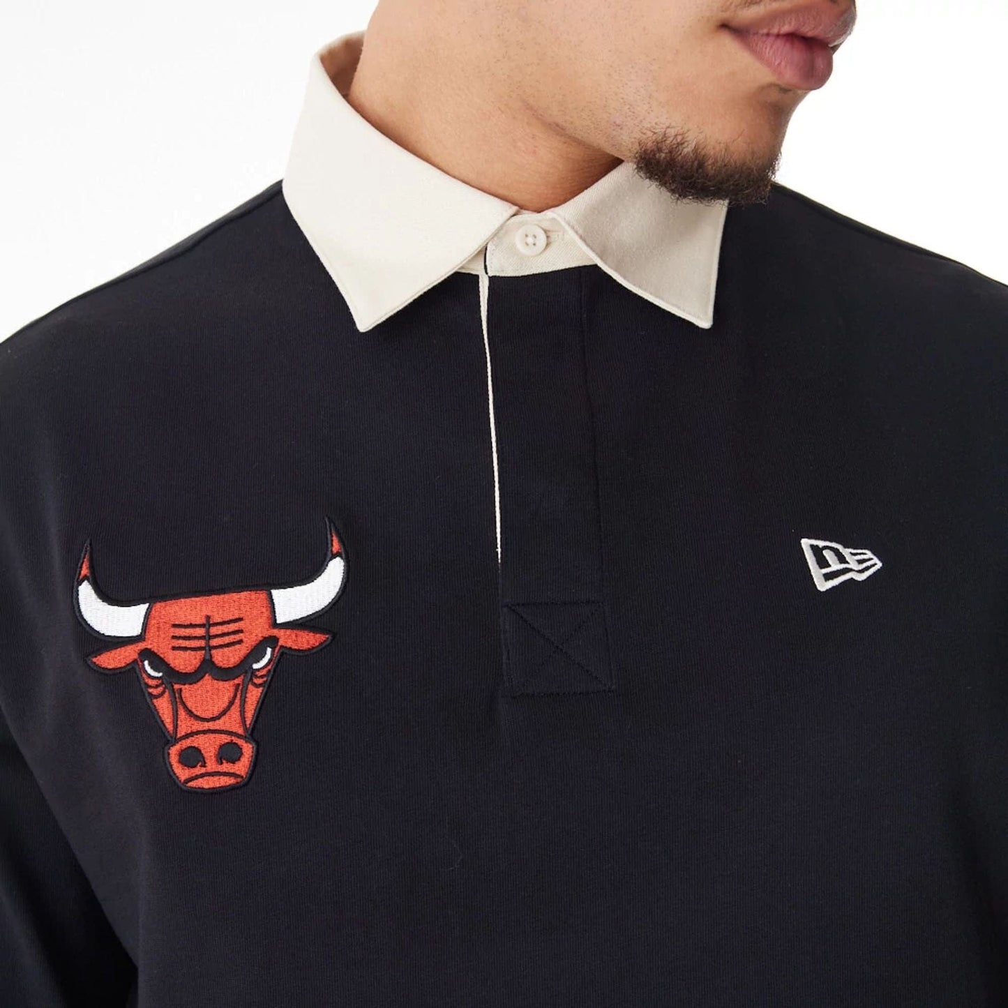 The Male model is wearing Chicago Bulls NBA Lifestyle Black Rugby Shirt  3