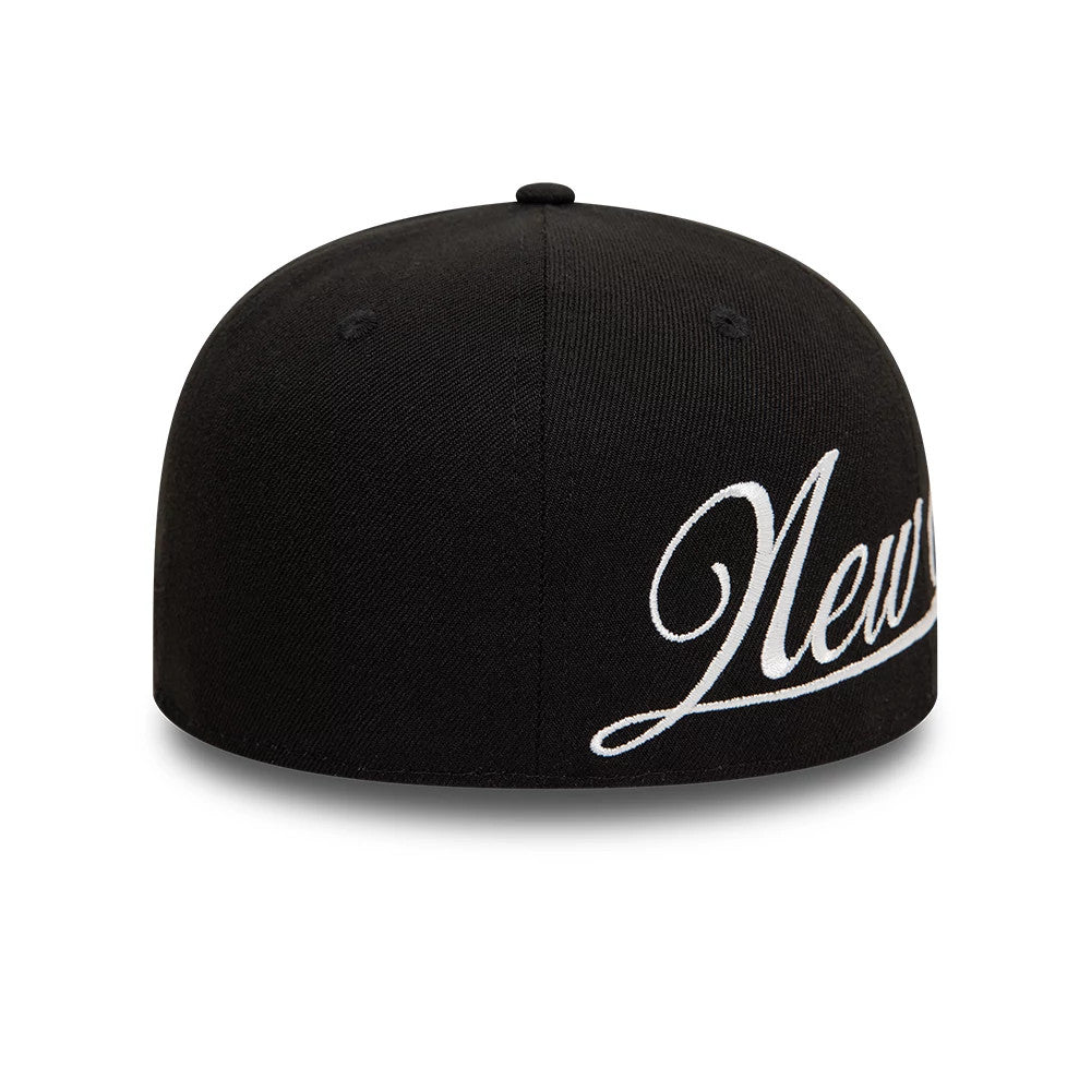 New Era Side Script Black New Era 59FIFTY Fitted Cap, rear view showing elegant white script lettering embroidered across the right side, contrasting with the structured black crown and centred black top button.