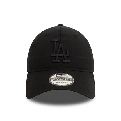 LA Dodgers Washed Black New Era 9TWENTY Adjustable Cap, front view showing the raised black embroidered LA logo on the front panel and the 9TWENTY size sticker on the curved visor.