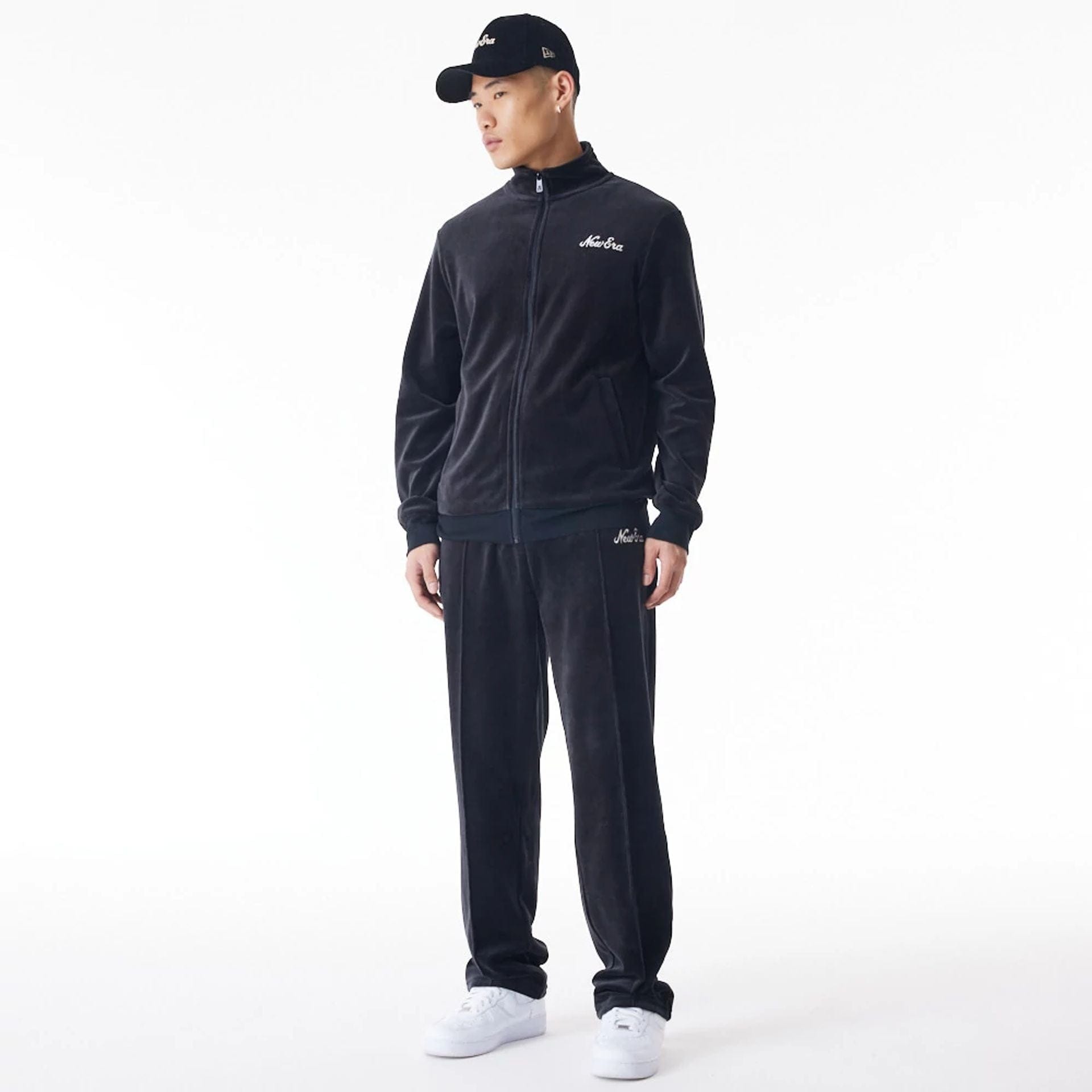 The Male model is wearing  New Era Velour Black Track Jacket  4