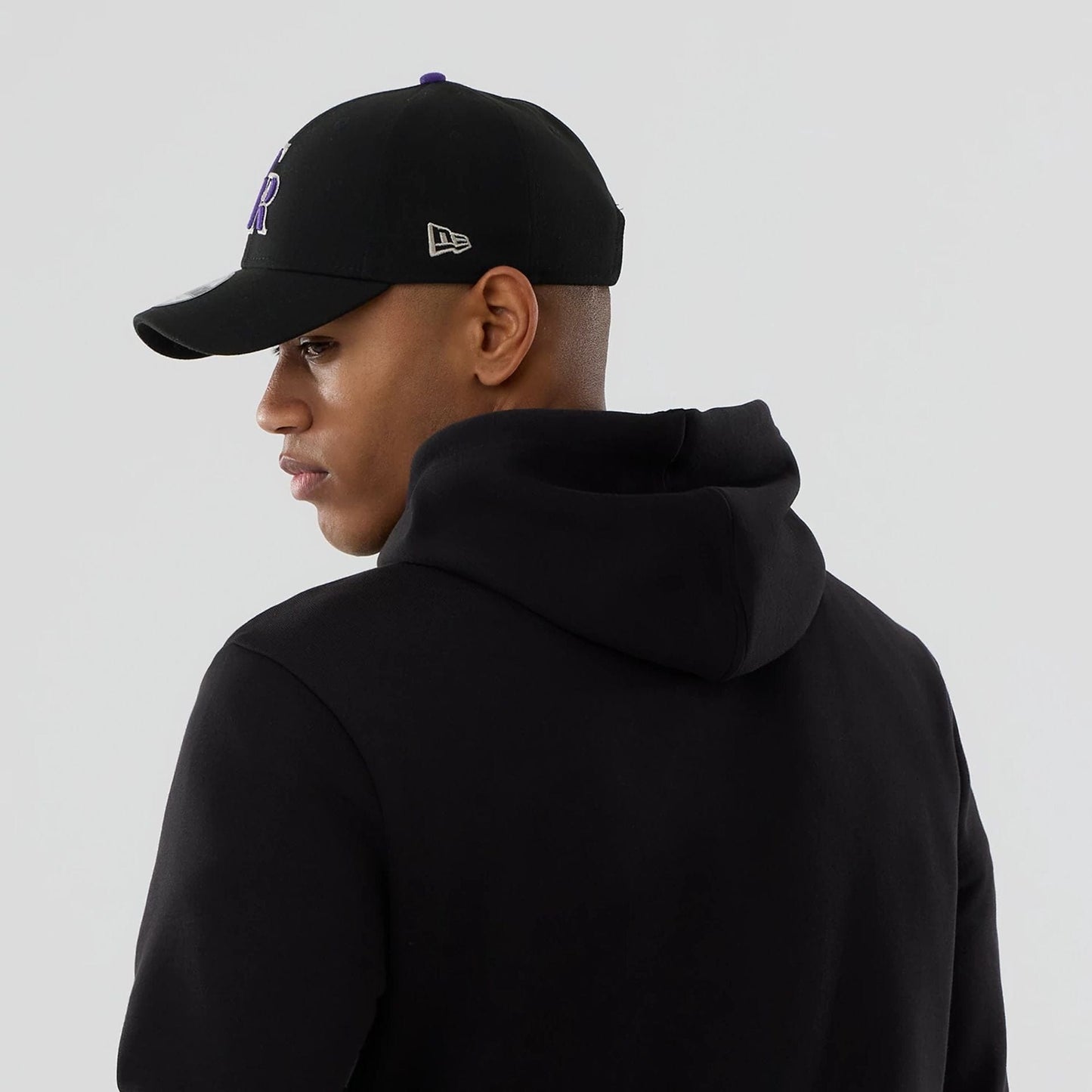 The Male model is wearing Colorado Rockies MLB Black Pullover Hoodie 7