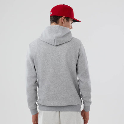 New Era Philadelphia Phillies MLB Grey Pullover Hoodie, rear view showing the simple grey hood and ribbed waistband, worn by a model also wearing a red cap with a white logo on the back.