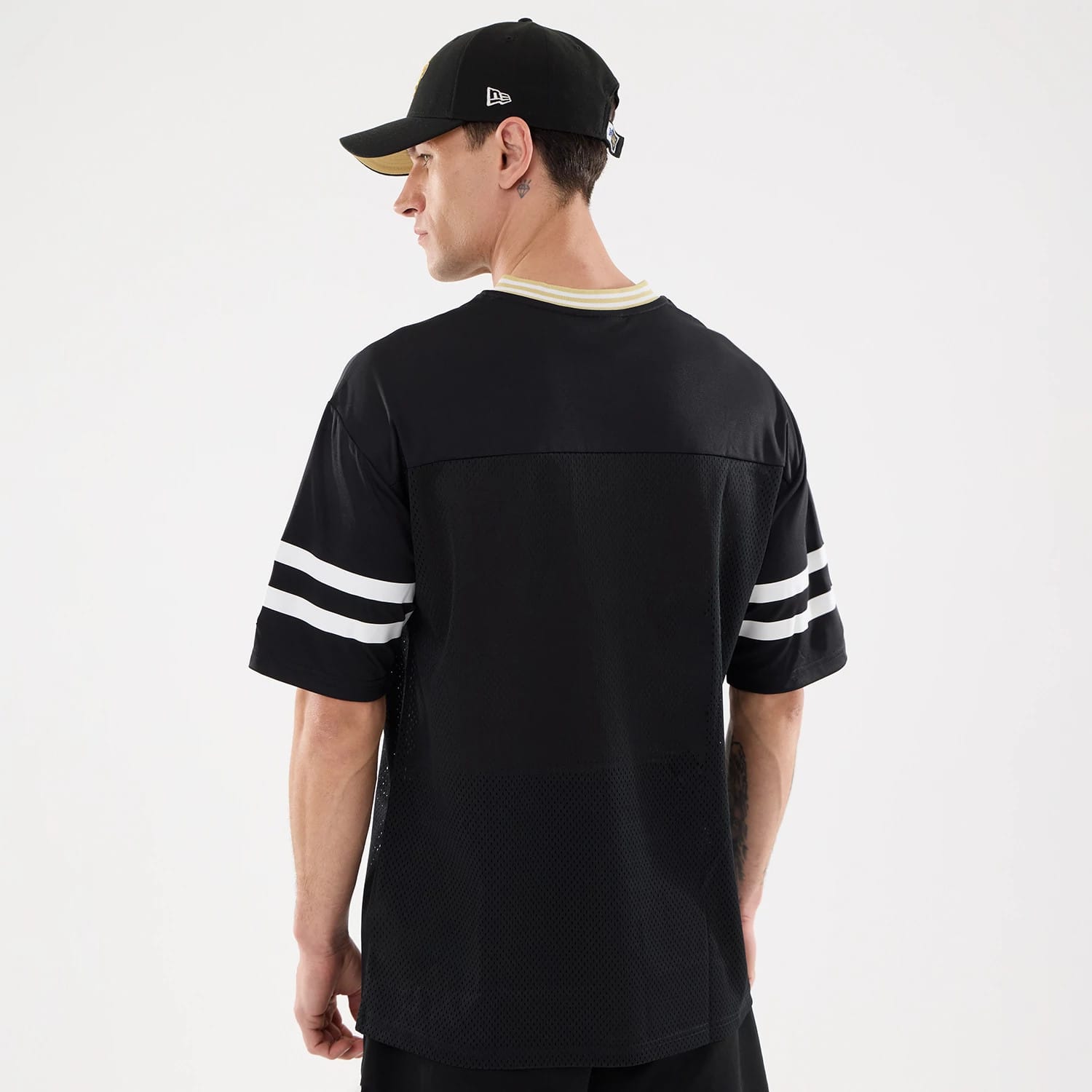 The Male model is wearing New Orleans Saints NFL Mesh Black Mesh Jersey 2