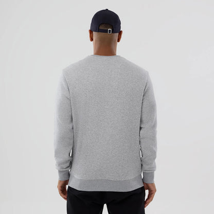 New Era MLB Generic Logo Grey Crew Neck Sweater, back view on a model wearing a dark cap, showing the simple heather grey design with ribbed cuffs and waistband, offering a casual yet clean look.