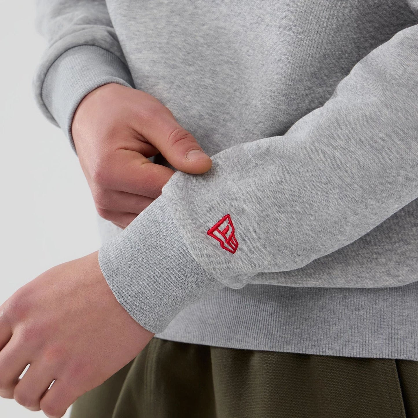 The Male model is wearing NFL Generic Logo Grey Crew Neck Sweater 5