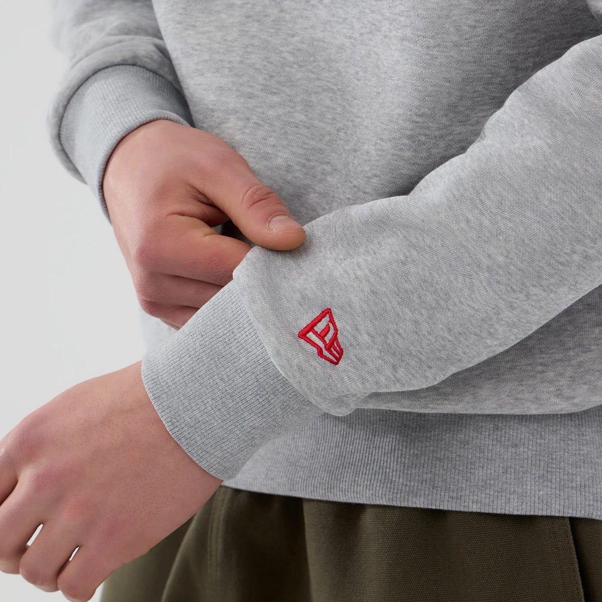 The Male model is wearing NFL Generic Logo Grey Crew Neck Sweater 5
