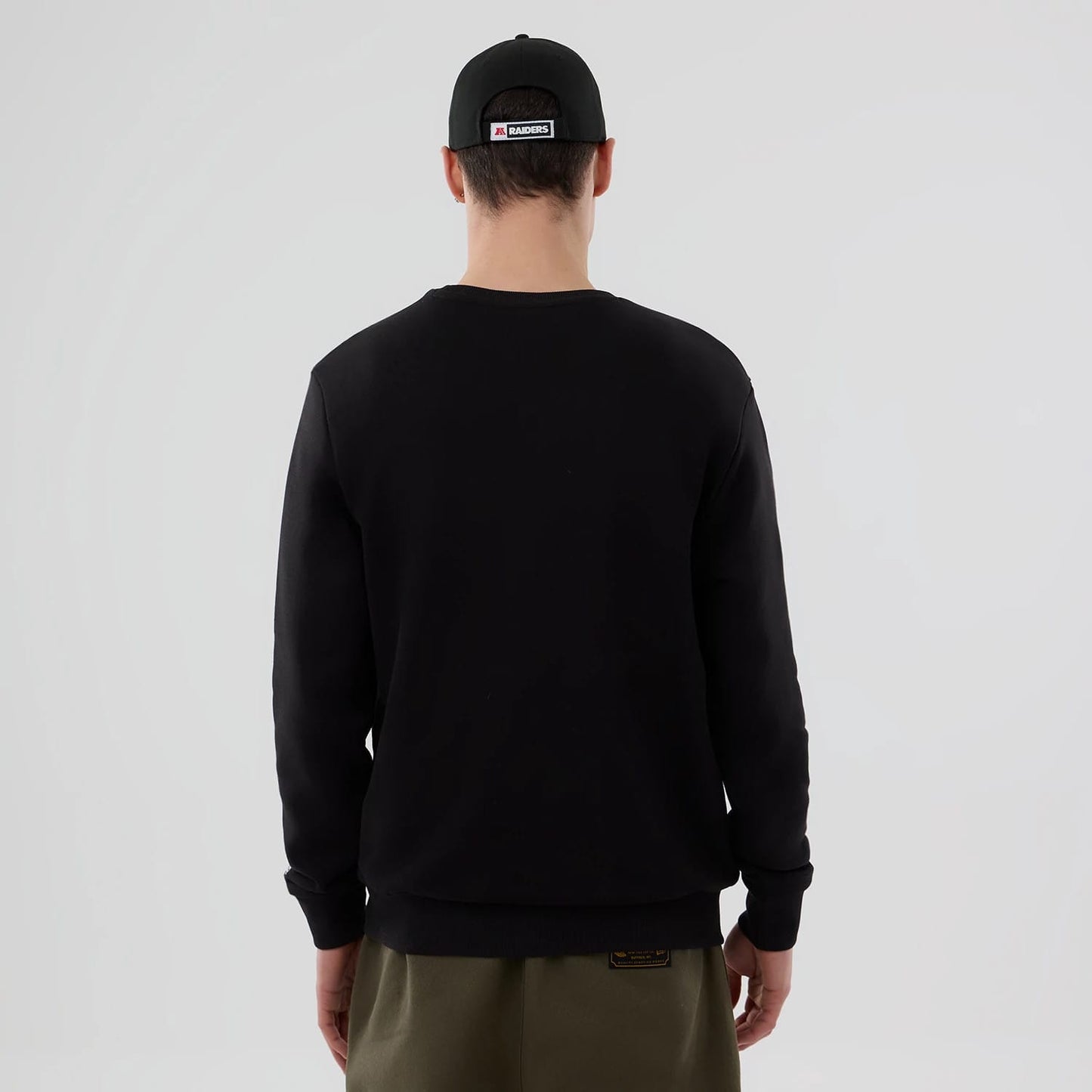 The Male model is wearing Las Vegas Raiders NFL Core Black Crew Neck Sweater 2