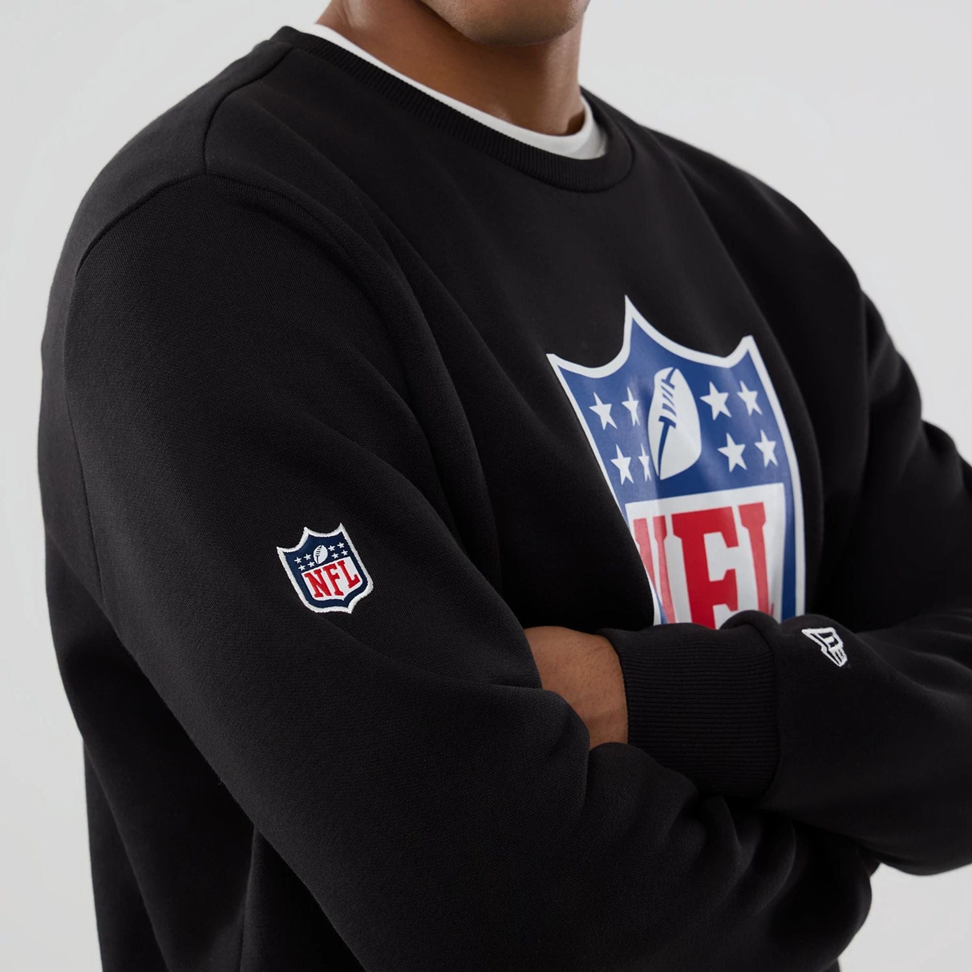 The Male model is wearing NFL Generic Logo Black Crew Neck Sweater 7