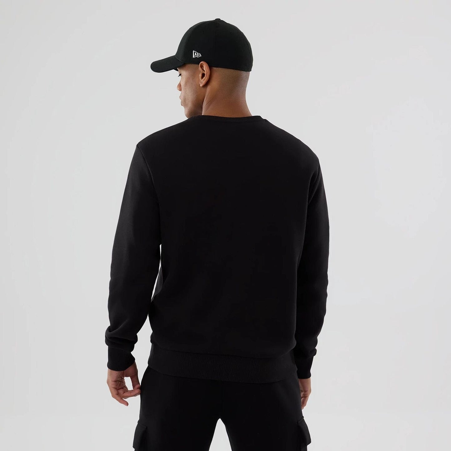 The Male model is wearing NFL Generic Logo Black Crew Neck Sweater 2