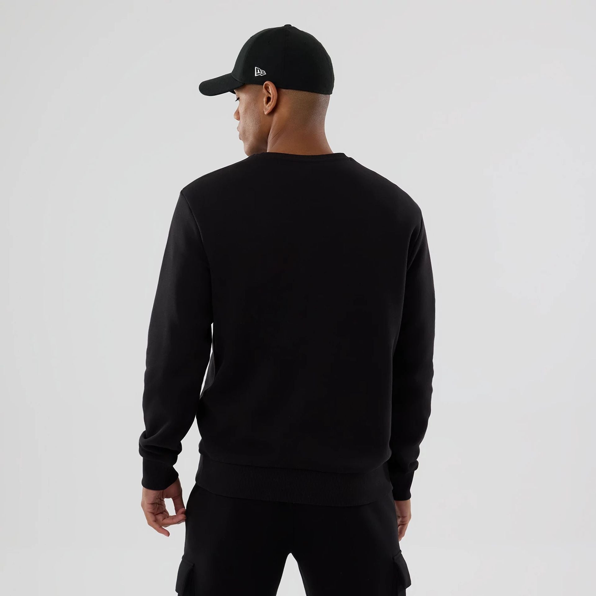 The Male model is wearing NFL Generic Logo Black Crew Neck Sweater 2