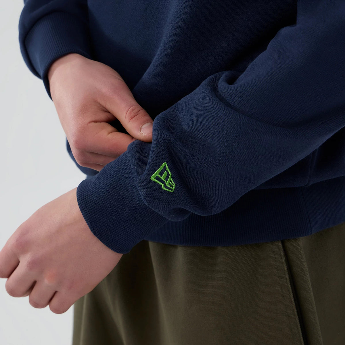 The Male model is wearing Seattle Seahawks NFL Dark Blue Crew Neck Sweater 5