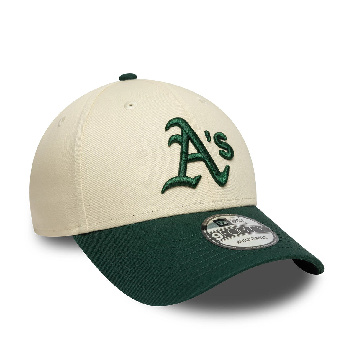 Athletics Colour Block Cream New Era 9FORTY Adjustable Cap, three-quarter view showing the dark green raised embroidered A's logo on the front panel, dark green visor with 9FORTY size sticker and cream crown with matching top button.